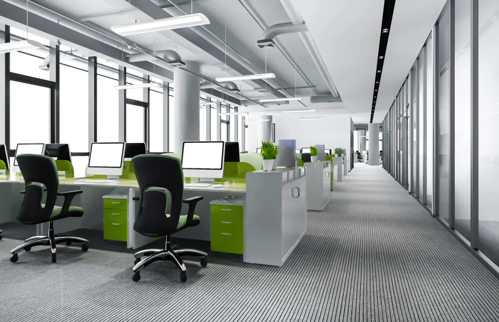 Modern commercial office with workstations, office chairs, and glass partitions maintained in a clean environment.